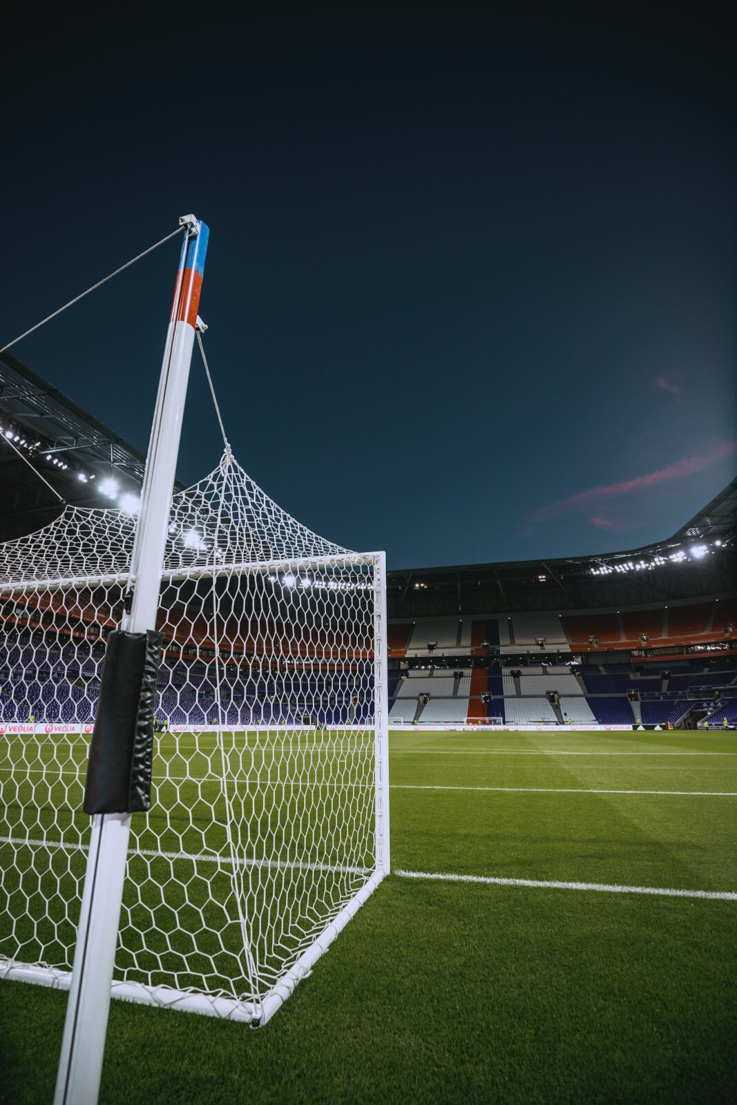 Soccer goal net at sunset, representing the global appeal of the World Cup