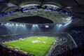 Aerial view of a modern soccer stadium at twilight