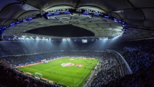 Aerial view of a modern soccer stadium at twilight