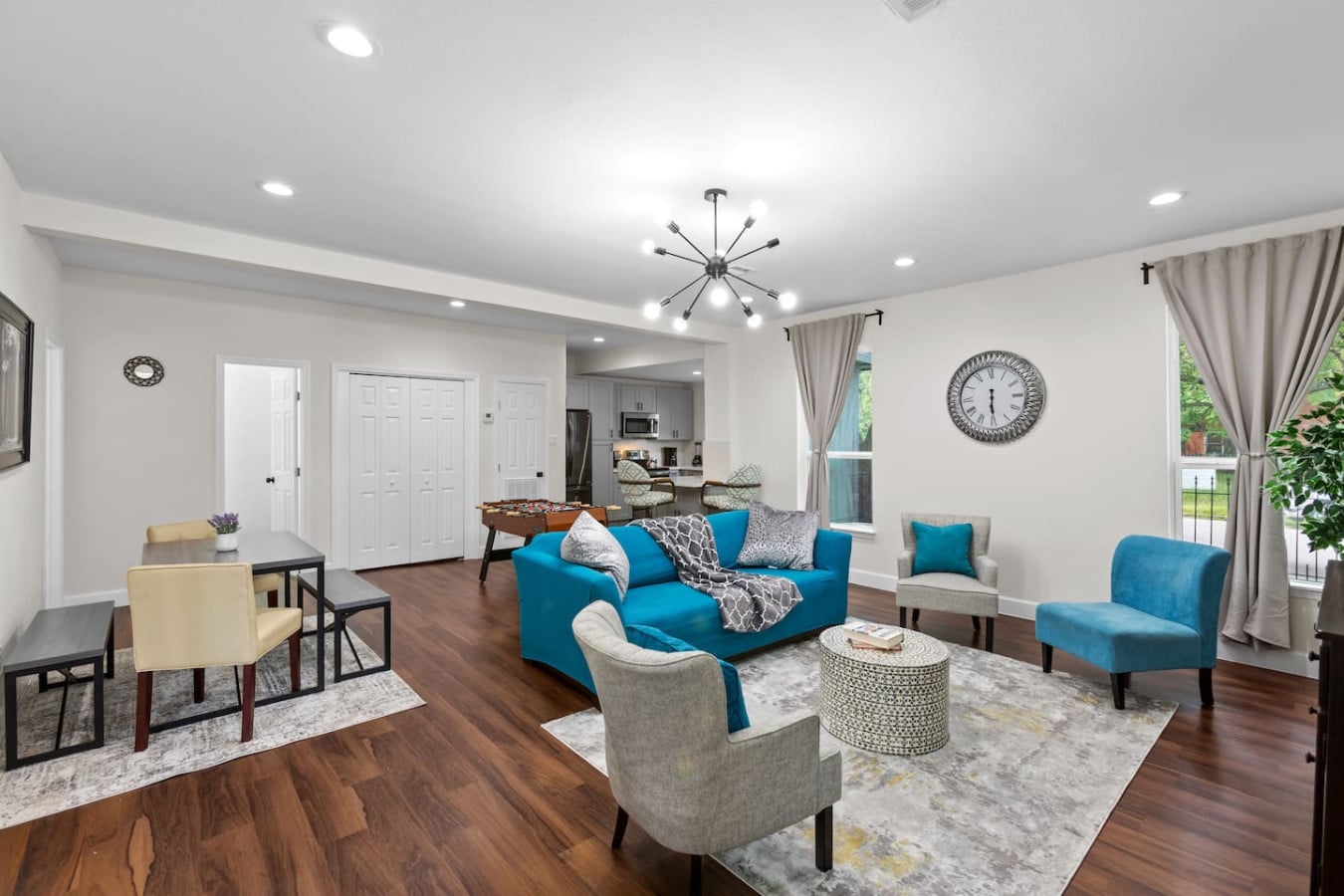 Furnished game room and dining area staged for a Houston-area Airbnb guest house