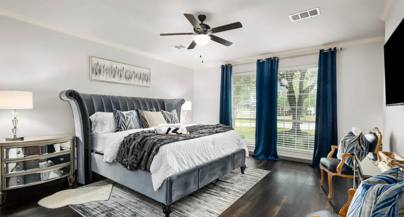 Vacation rentals beat hotels spacious bedroom in Conroe rental property