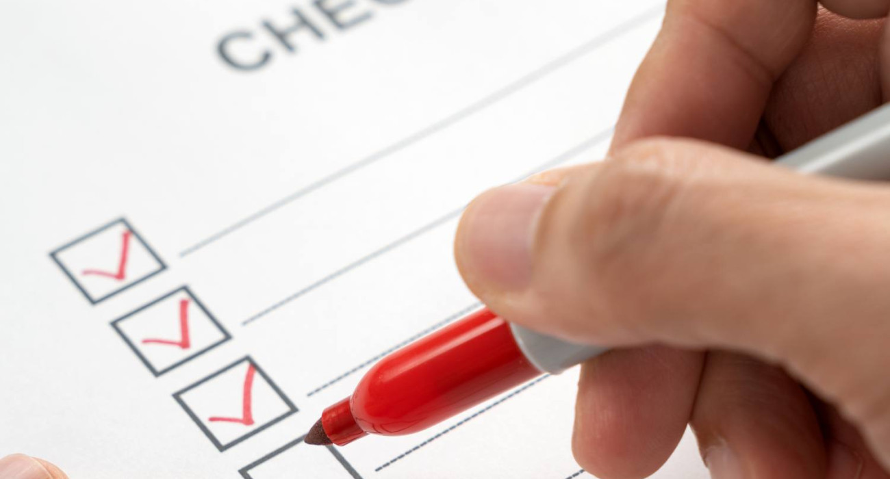 hand-with-red-marker-pen-marking-on-checklist-box-2024-12-13-18-33-26-utc-1