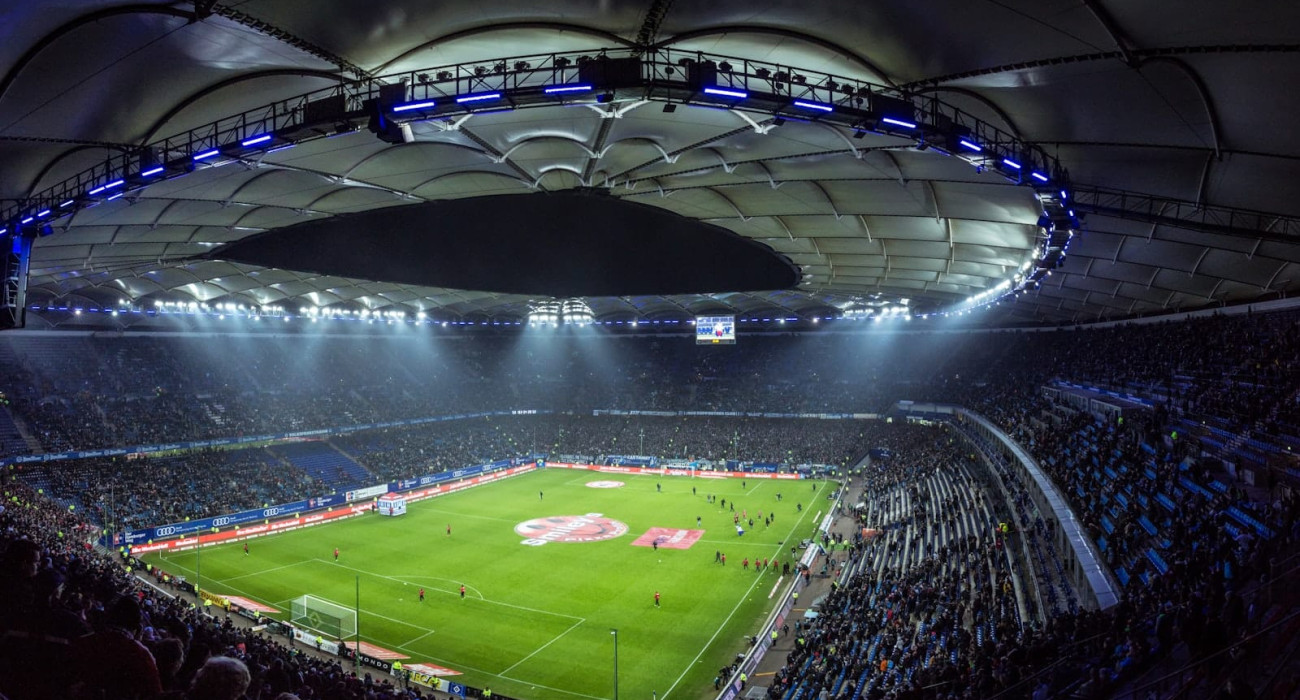 Aerial view of a modern soccer stadium at twilight